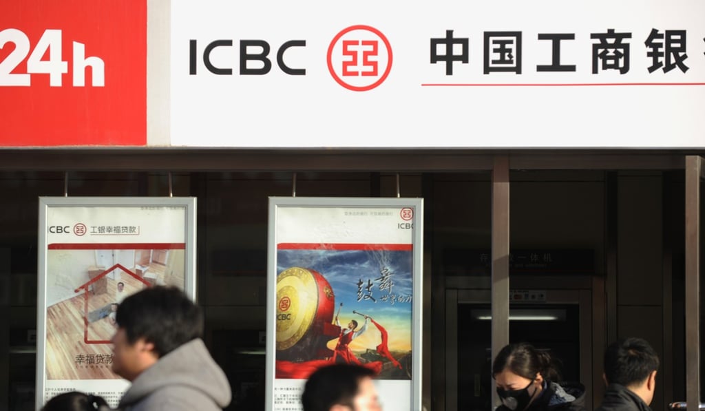 People walk past an outlet of Chinese bank ICBC in Beijing, which is being tapped for a possible Russian yuan bond sale. Photo: AFP