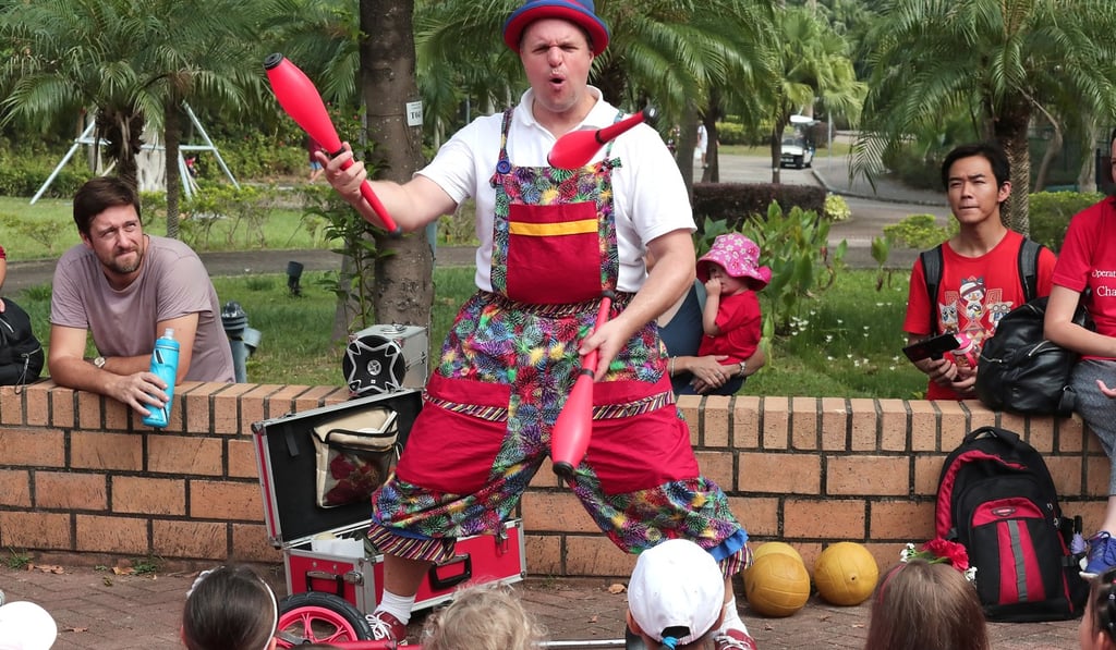 A juggler performs at the end of the walk to entertain participants. Photo: Jonathan Wong