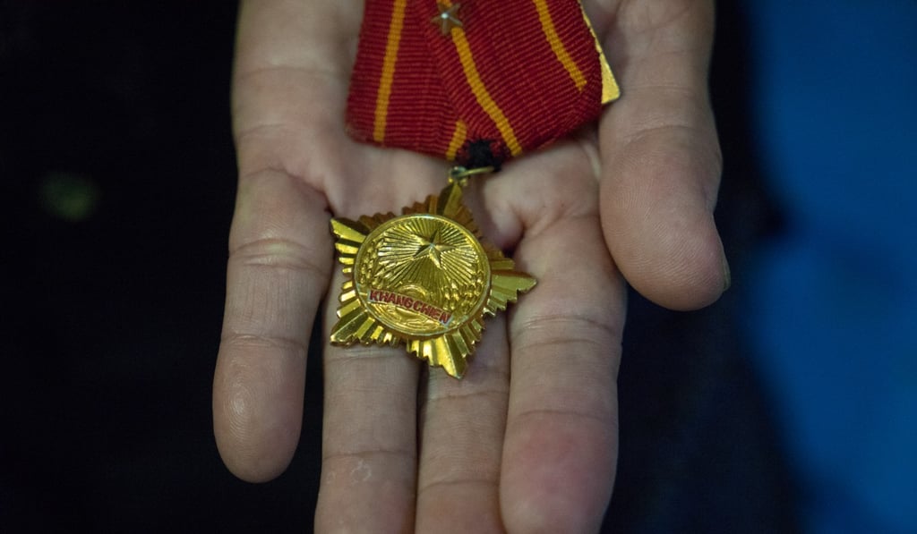 Tran Thi Dong’s medal says ‘Resistance War’, which is short for ‘The Resistance War Against America’. Photo: Bennett Murray