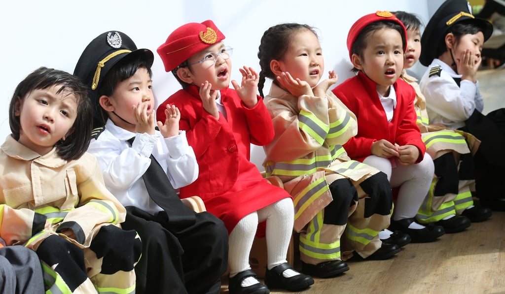 Children dress in a variety of professional outfits at the Airport Preschool Opening Ceremony at the Airport World Trade Centre in March. Photo: K.Y. Cheng