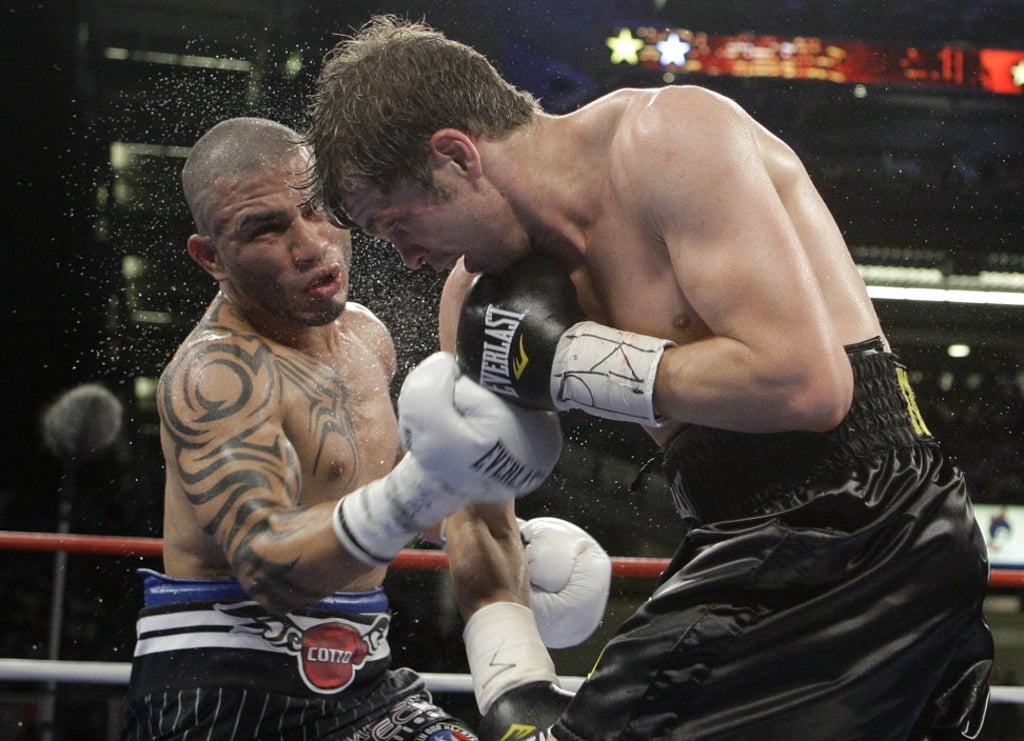 Cotto lands a right hand on Yuri Foreman. Photo: AP Cotto lands a right hand on Yuri Foreman. Photo: AP