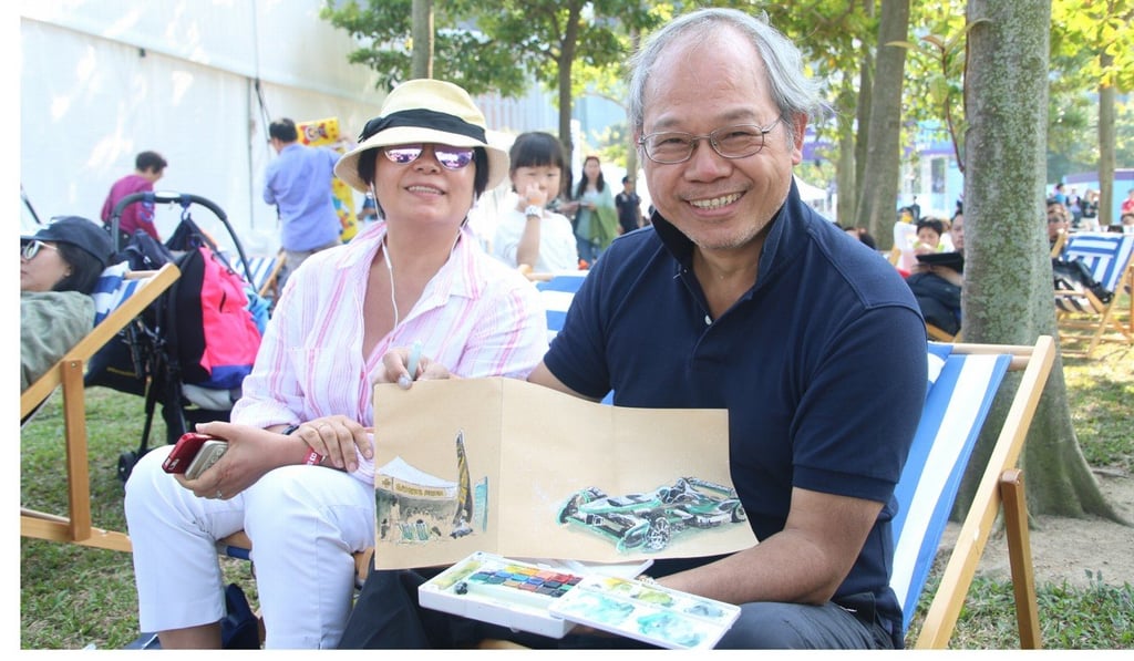 Richie Cheung shows off his sketches with wife, Mable.