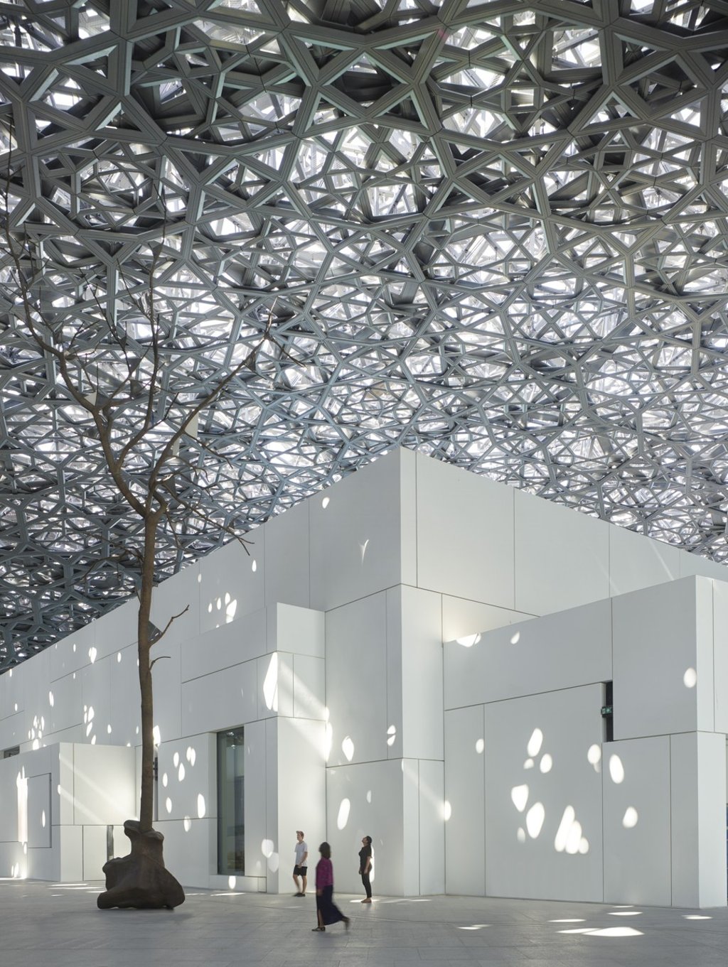 The museum dome's eight layers of interlocking steel and aluminium create more than 7,800 “stars” that filter sunlight, creating a microclimate and reducing the temperature inside by five degrees Celsius. Photo: Roland Halbe The museum dome's eight layers of interlocking steel and aluminium create more than 7,800 “stars” that filter sunlight, creating a microclimate and reducing the temperature inside by five degrees Celsius. Photo: Roland Halbe