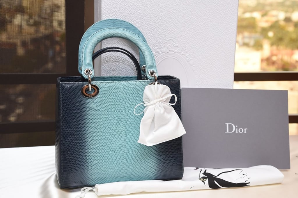A mid-sized Lady Dior shiny turquoise/navy ombre graded lizard skin bag – one of only 19 made – had an estimated value of US$$12,500 to US$15,000. Photo: AFP