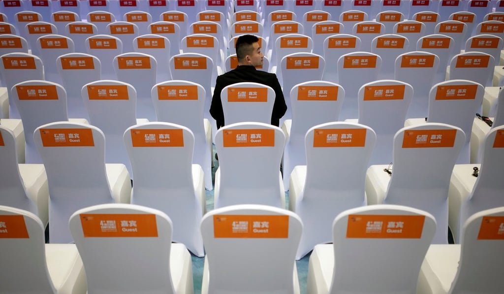 A security guard sits on a chair before the opening ceremony of the fourth World Internet Conference in Wuzhen. Photo: Reuters