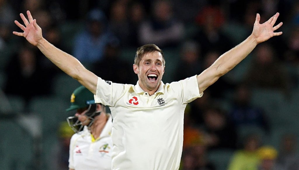 England bowler Chris Woakes celebrates the wicket of Australia captain Steve Smith as the tourists fight back in Adelaide. Photo: AFP England bowler Chris Woakes celebrates the wicket of Australia captain Steve Smith as the tourists fight back in Adelaide. Photo: AFP