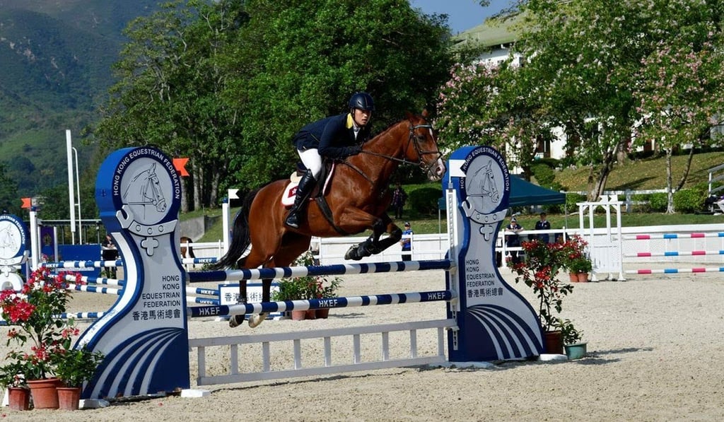 Nathaniel Chan and Jockey Club Tilburg negotiate a fence.