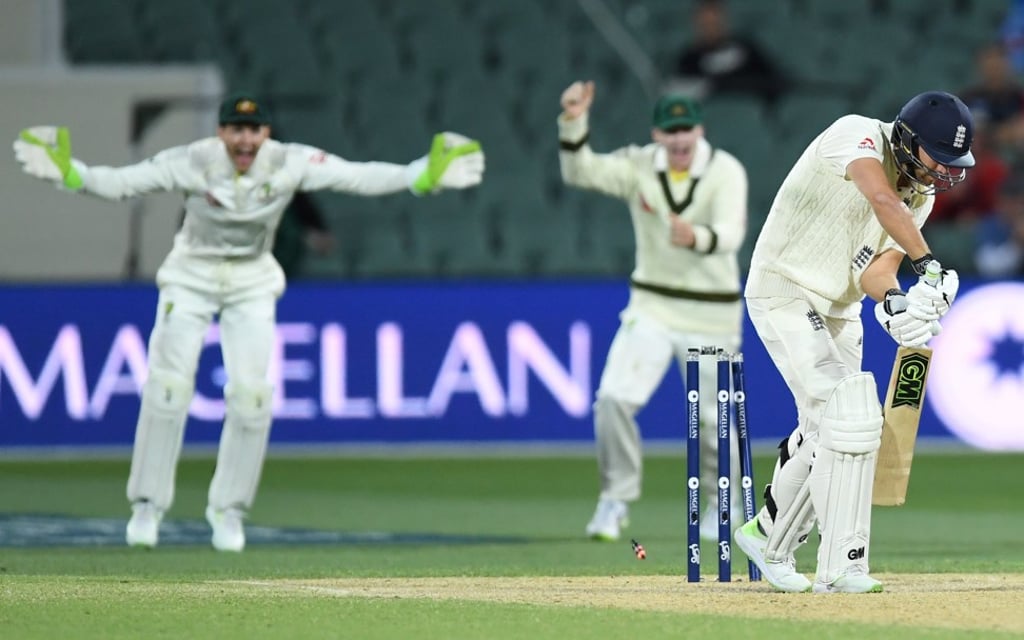 Pat Cummins of Australia clean bowls England's Dawid Malan to leave the tourists four wickets down as they chase a record 354 to win the Ashes test in Adelaide, Photo: EPA