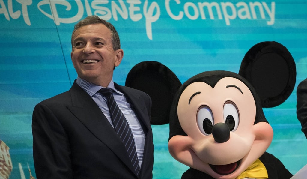 Chief executive officer and chairman of The Walt Disney Company Bob Iger and Mickey Mouse look on before ringing the opening bell at the New York Stock Exchangeon November 27. Photo: Agence France-Presse Chief executive officer and chairman of The Walt Disney Company Bob Iger and Mickey Mouse look on before ringing the opening bell at the New York Stock Exchangeon November 27. Photo: Agence France-Presse