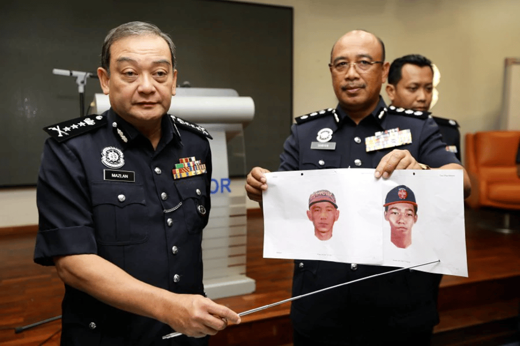 Selangor police chief Datuk Mazlan Mansor (left) points to the suspects’ photofits held by Shah Alam district police chief ACP Shafien Mamat (right) during the press conference at state police headquarters. Photo: ROSLIN MAT TAHIR/New Straits Times Selangor police chief Datuk Mazlan Mansor (left) points to the suspects’ photofits held by Shah Alam district police chief ACP Shafien Mamat (right) during the press conference at state police headquarters. Photo: ROSLIN MAT TAHIR/New Straits Times