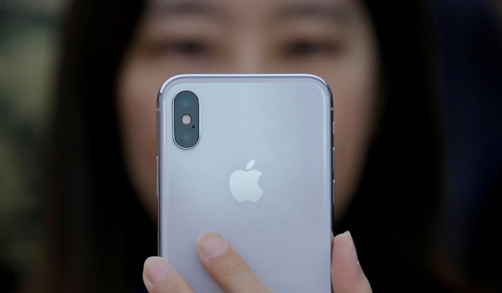A new iPhone X during a presentation in Beijing, China. Devices like smartphones are boosting the consumption of gold. Photo: Reuters