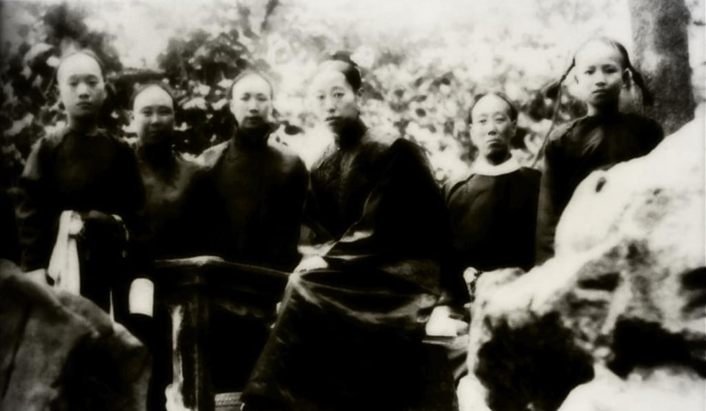 Dowager Empress Longyu (centre) with eunuchs. Picture: Alamy