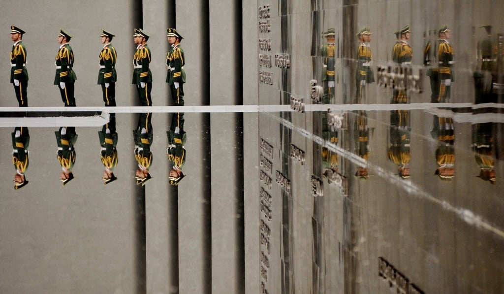 Armed police take part in a ceremony at the state memorial to the Nanking massacre in Jiangsu province, China. Photo: ChinaFotoPress