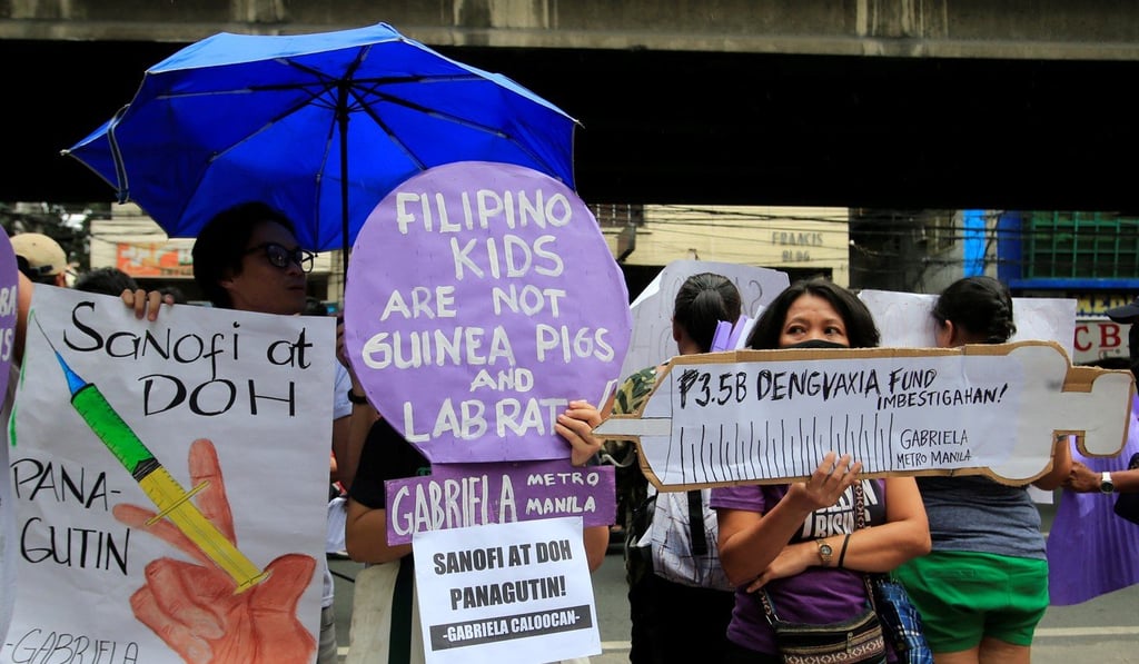 Filipinos protest in front of the Department of Health in Manila. Photo: Reuters