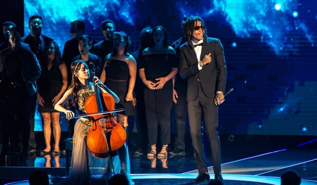American rapper Wiz Khalifa (right) joins cellist Nana Ou-yang in a performance of See You Again at the Breakthrough Prize award ceremony. American rapper Wiz Khalifa (right) joins cellist Nana Ou-yang in a performance of See You Again at the Breakthrough Prize award ceremony.