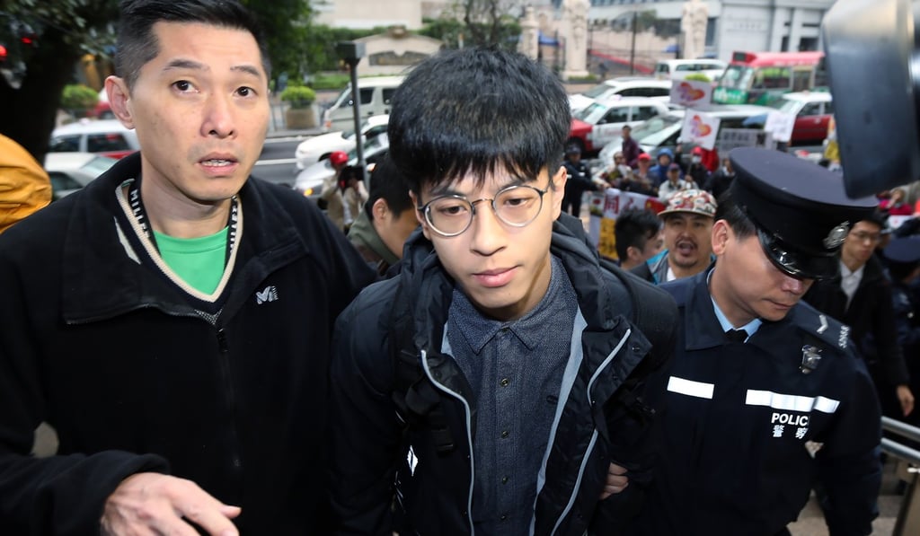 Hong Kong Indigenous leader Ray Wong (centre) failed to return his passport to police following a trip to Europe. Photo: Felix Wong