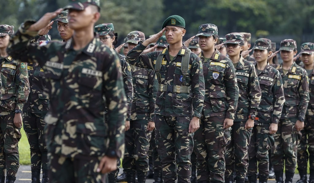 Cadets of the Reserve Officers' Training Corps (ROTC) salute in formation at Camp Aguinaldo in Quezon City, east of Manila, Philippines. Photo: EPA-EFE