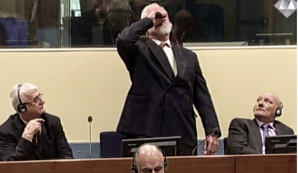 Croatian former general Slobodan Praljak swallowing poison at the UN war crimes court. Photo: AFP