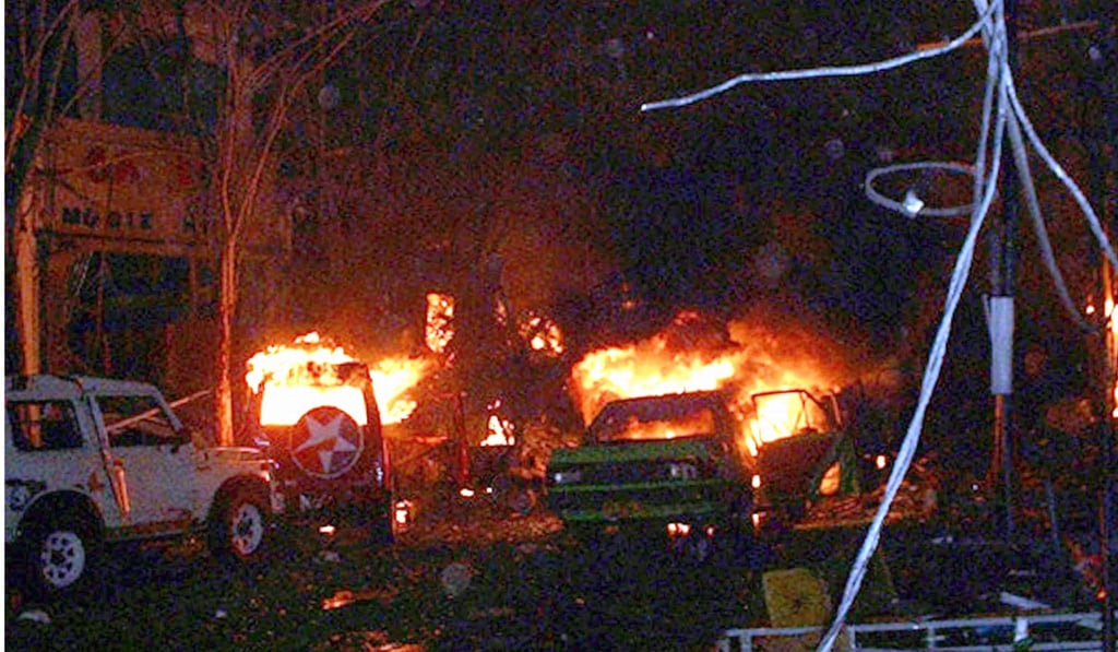 Buildings and cars on fire after a bomb blast in Kuta, Bali in October 2002. Photo: AFP