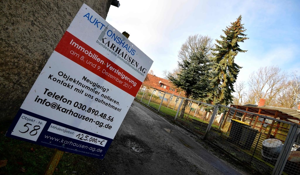 A sign announcing the auction. Photo: AFP