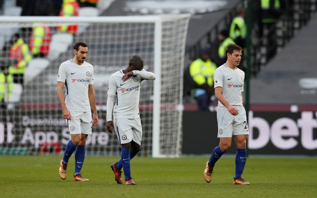 Chelsea’s Cesar Azpilicueta and team mates look dejected at half-time. Photo: Reuters