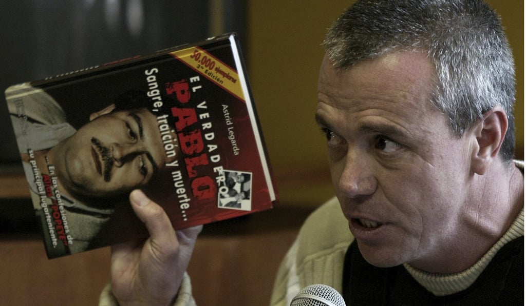 File photo of Jhon Jairo Velasquez holding a book about Pablo Escobar. Photo: AP File photo of Jhon Jairo Velasquez holding a book about Pablo Escobar. Photo: AP