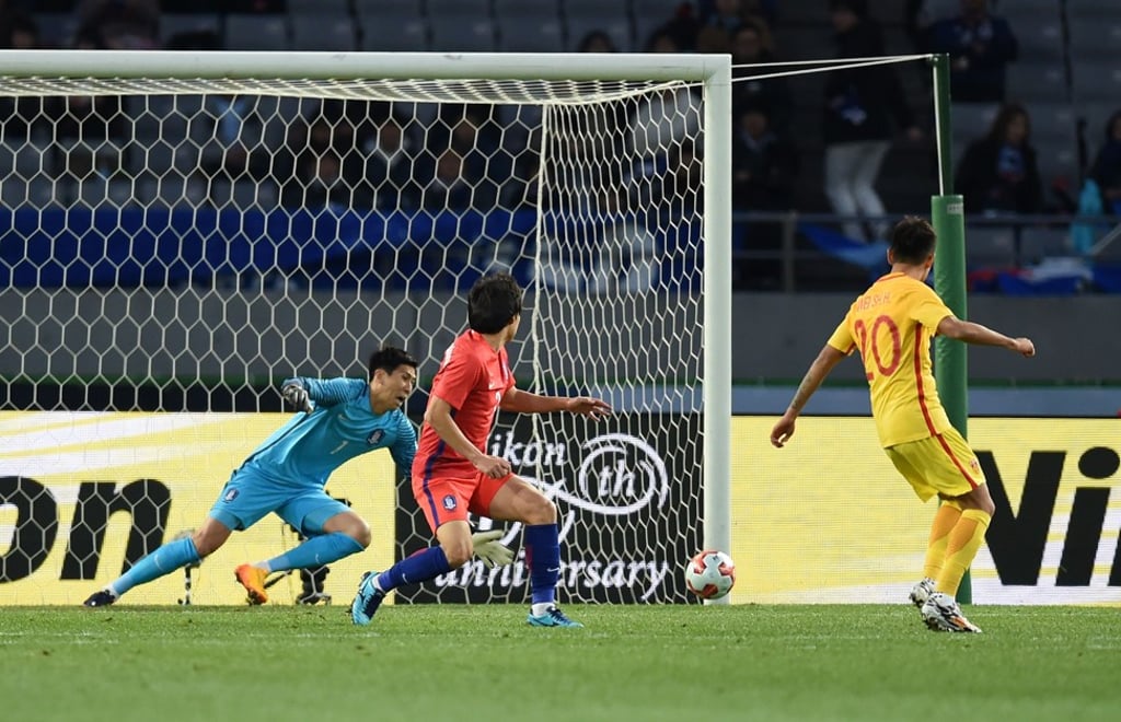 Wei Shihao scores his first international goal for China against South Korea in the opening game of the EAFF E-1 football championship. Photo: AFP