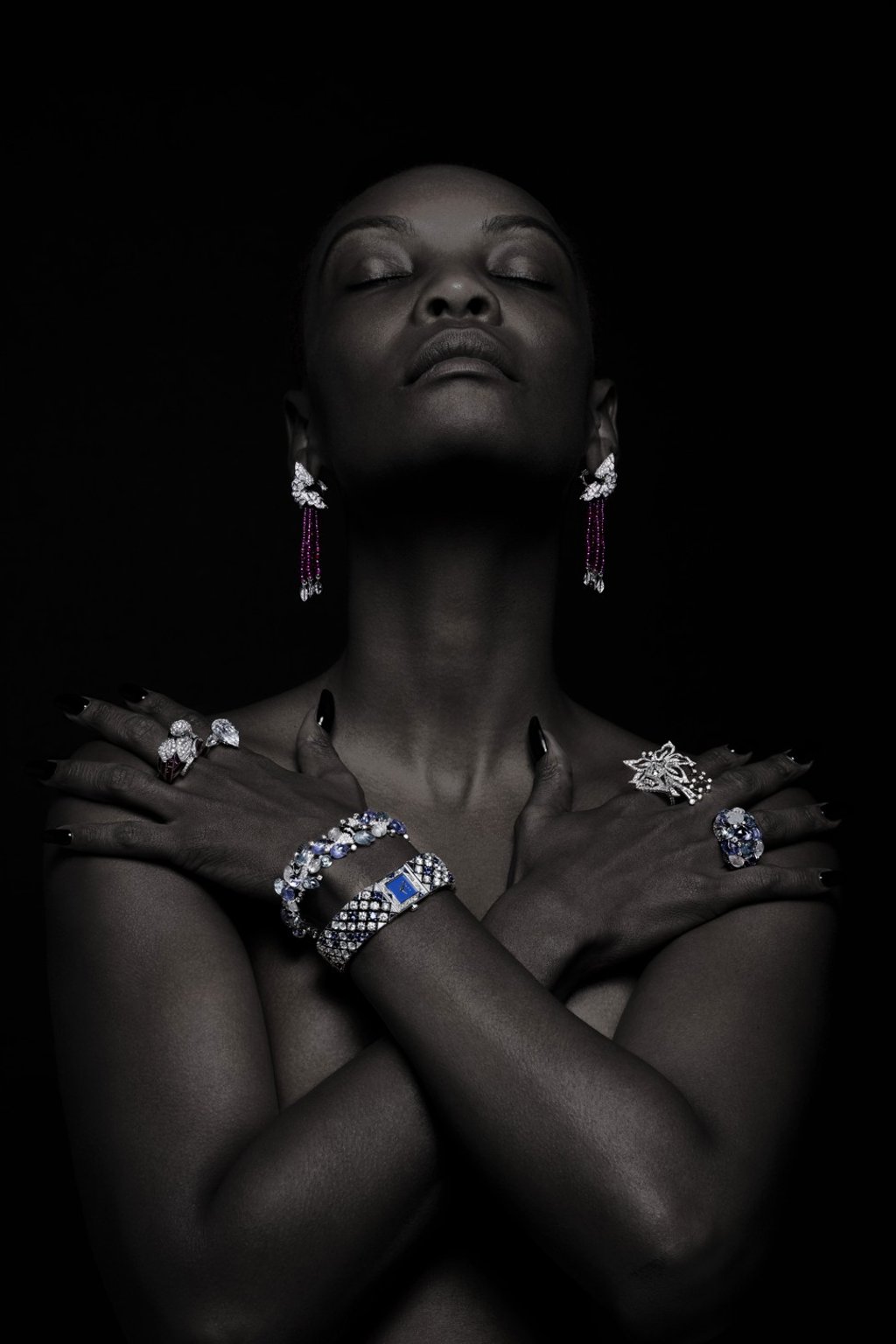 CARTIER white gold earrings with rubies, mother-of-pearls, emeralds and diamonds, price on request. Left hand, from left: CARTIER platinum ring with rubies, mother-of-pearls, emeralds and diamonds, price on request; GRAFF white gold ring with 7.17ct pear-shaped diamond, price on request; CARTIER white gold bracelet with diamonds, aquamarines, tanzanites, moonstones and onyx, price on request; GRAFF Snowfall watch in white gold with sapphires and diamonds, price on request. Right hand, from top: PIAGET Limelight ring in white gold, HK$2,790,000; CARTIER white gold ring with diamonds, aquamarines, tanzanites moonstones and onyx, price on request