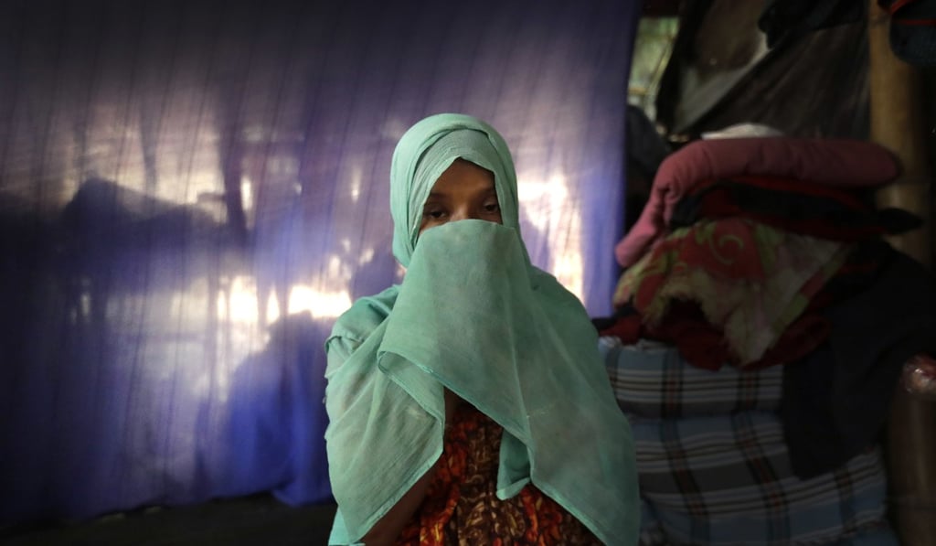 F, 22 and pregnant, prays in her tent in Kutupalong refugee camp in Bangladesh. Photo: AP F, 22 and pregnant, prays in her tent in Kutupalong refugee camp in Bangladesh. Photo: AP