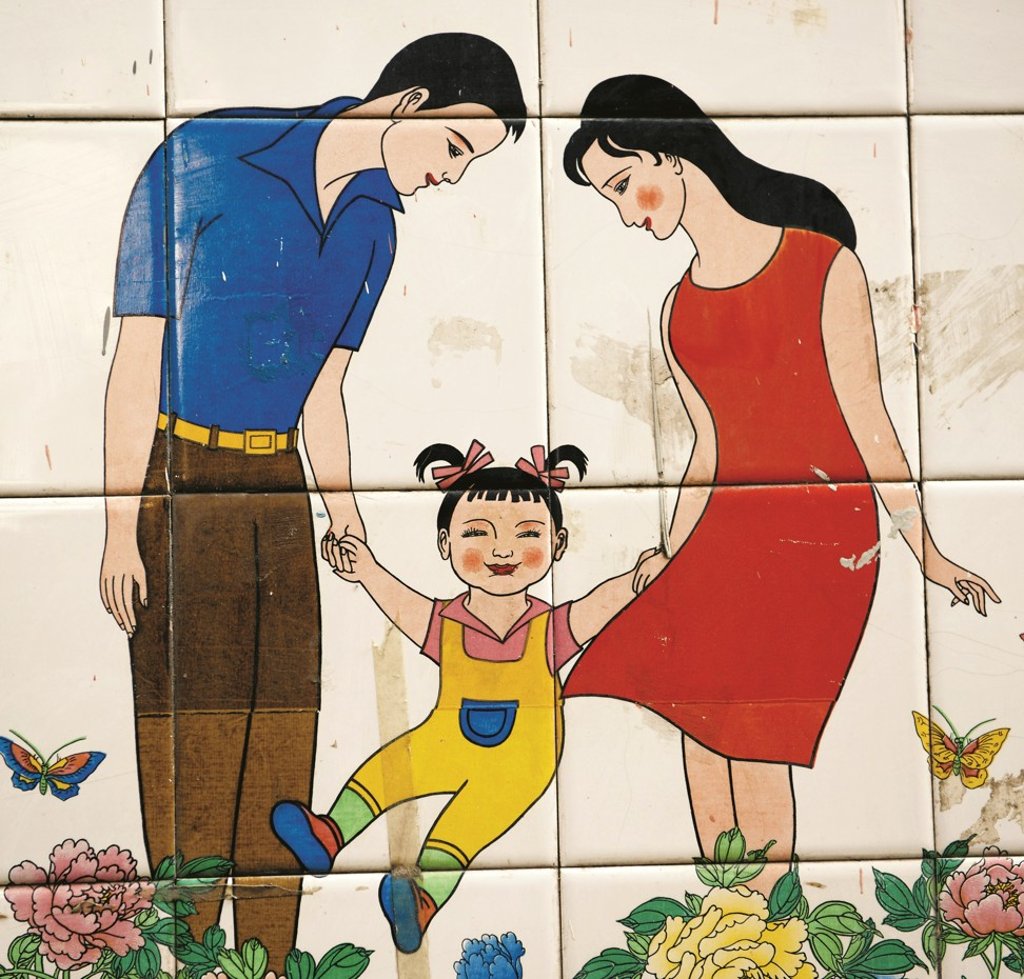 A mural promotes the one-child policy in Nanchang, Jiangxi province, China. Photo: Alamy A mural promotes the one-child policy in Nanchang, Jiangxi province, China. Photo: Alamy