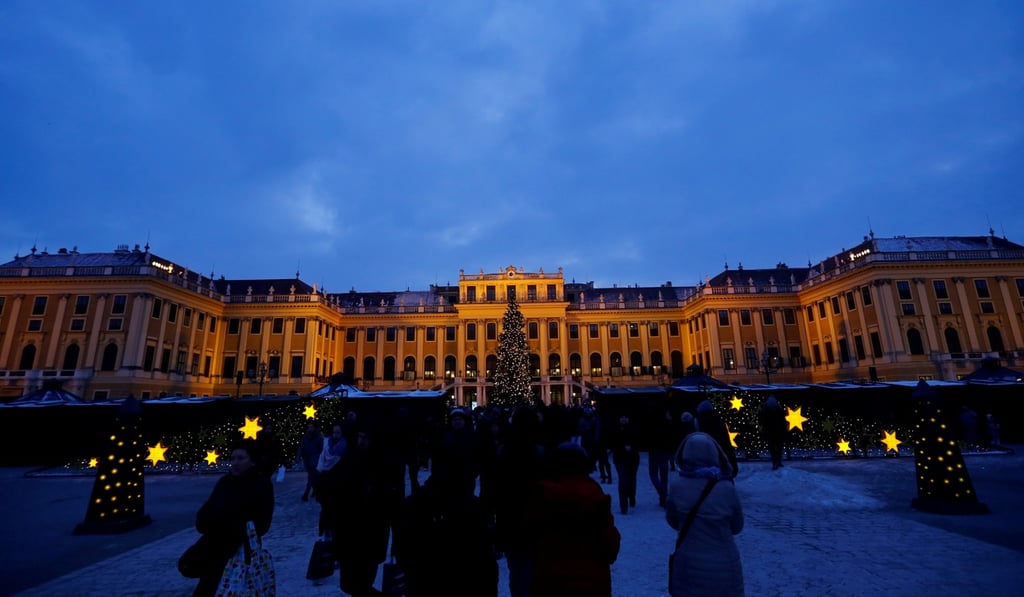 People visit the Christmas market in front of the Schoenbrunn palace in Vienna, Austria. Photo: Reuters