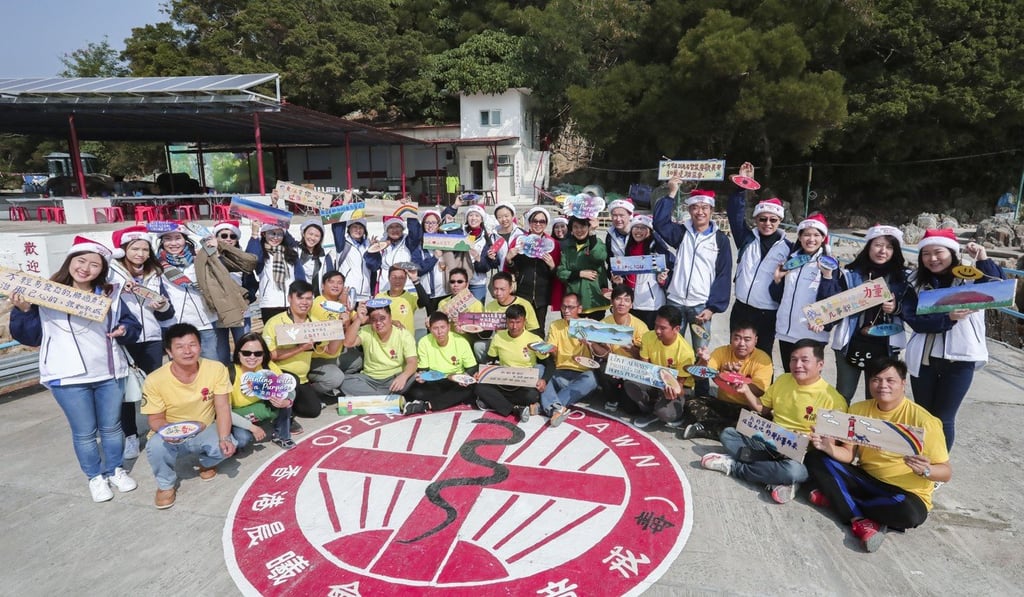 Operation Dawn students and volunteers from Deacons law firm. Photo: Jonathan Wong