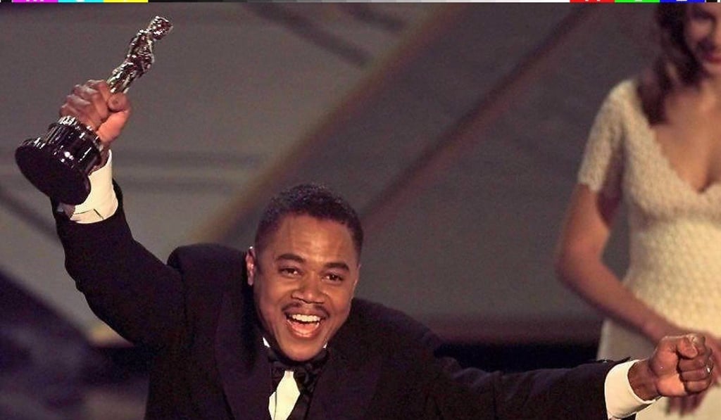 Actor Cuba Gooding Jnr holds up his Oscar after winning the best supporting actor award for his role in Jerry Maguire. Photo: AFP