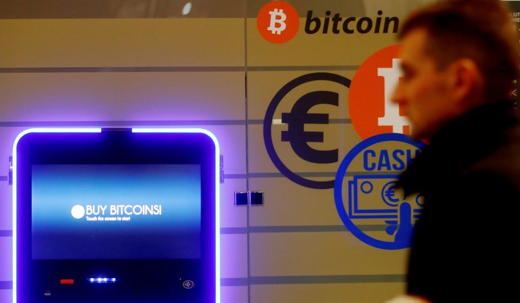 Banking at a bitcoin ATM in Vilnius, Lithuania. Photo: Reuters