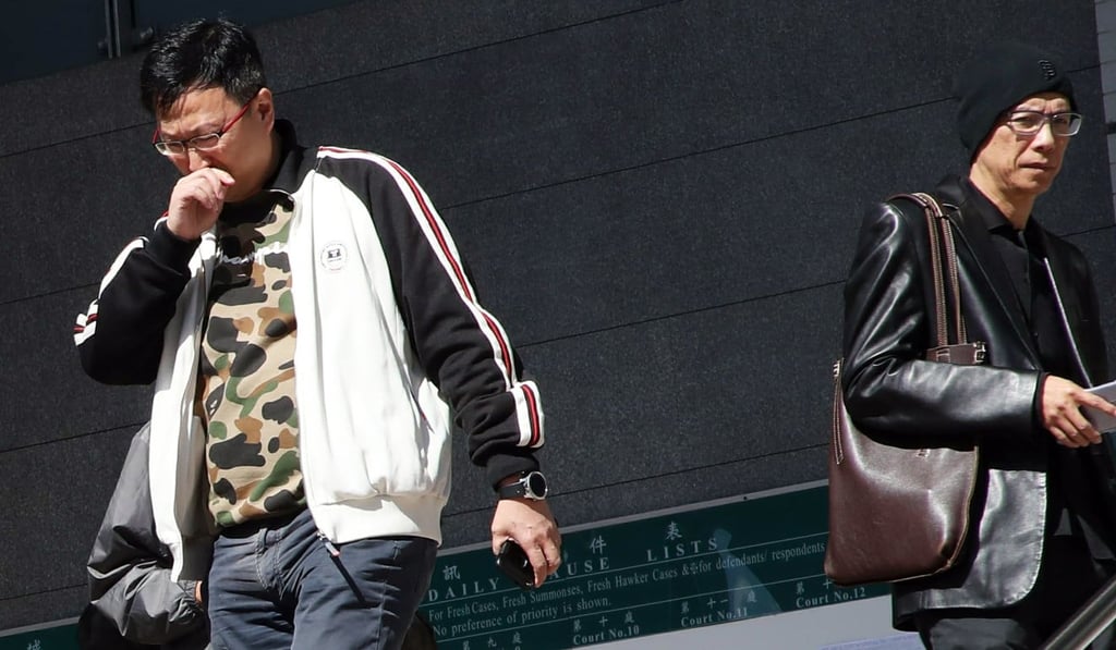 Uber drivers Adrain Cheung Yuk-fung (left) and Andrew Chan Pak-kay at Kowloon City Court. Photo: Edward Wong