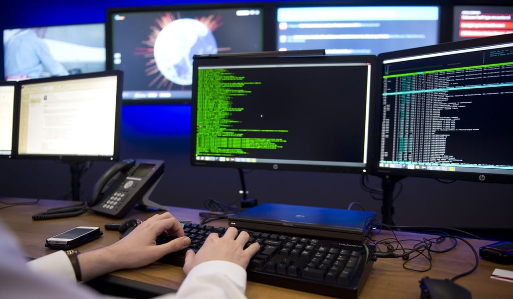 Hewlett Packard employees work in the HPcyber defence centre in Boeblingen, Germany. Photo: EPA