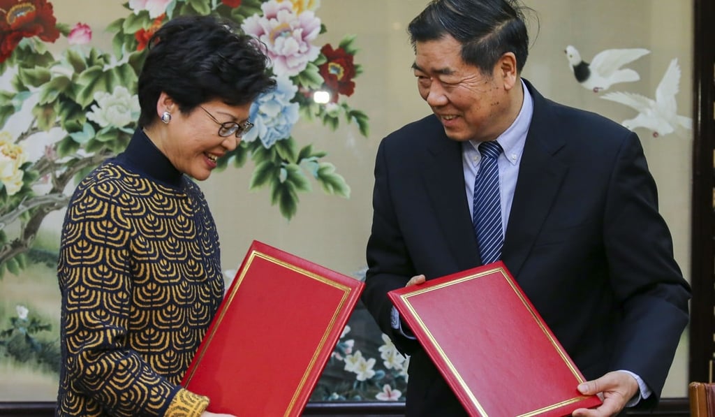 Chief Executive Carrie Lam concludes the belt and road agreement with National Development and Reform Commission chair He Lifeng, in Beijing on December 14. Photo: Dickson lee