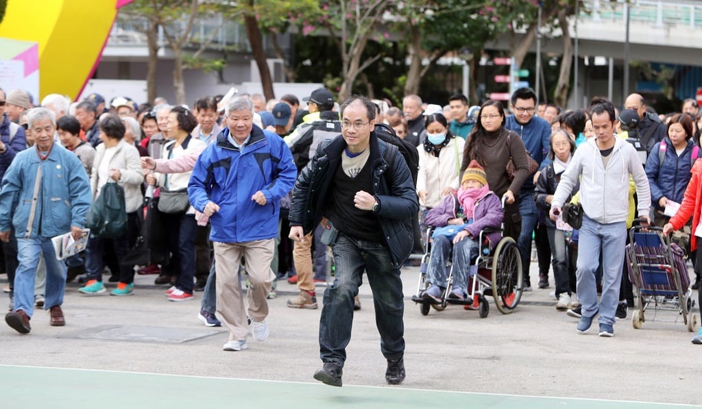 Shoppers rush into the expo at the opening of the event on Saturday morning. Photo: Winson Wong