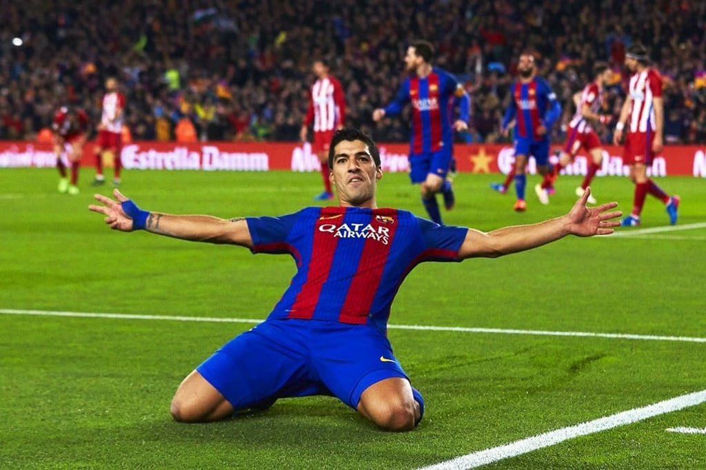 Barcelona's Uruguayan striker Luis Suarez celebrates scoring against Atletico Madrid. Photo: EPA