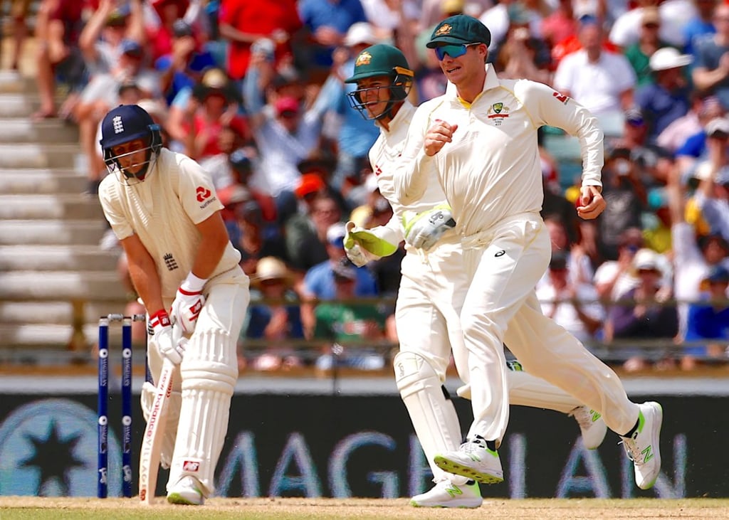 Australia captain Steve Smith celebrates after taking a catch to dismiss England captain Joe Root in Perth. Photo: Reuters