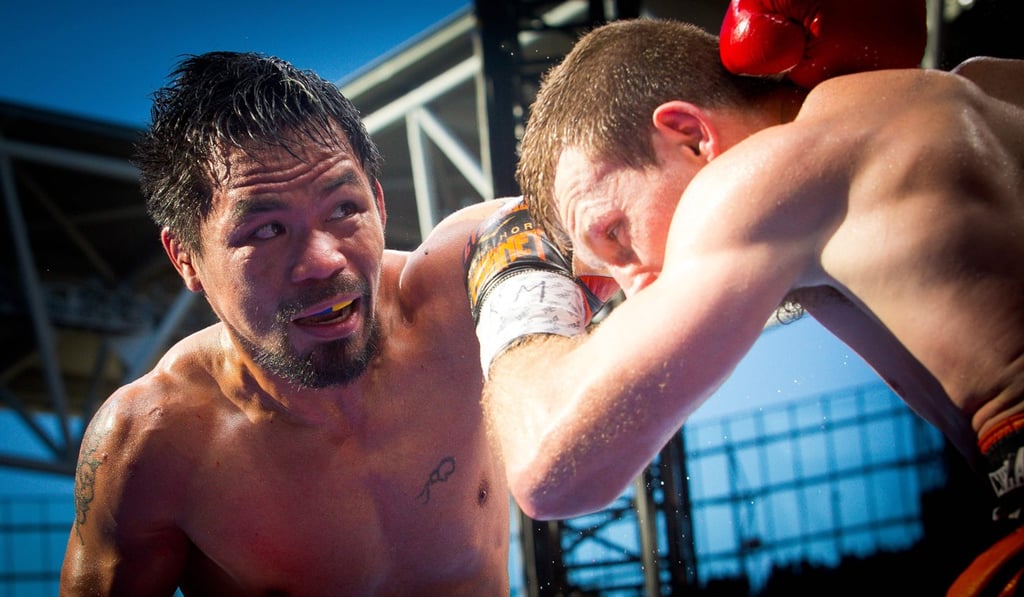 UFC president Dana White has played down talk of Conor McGregor fighting Manny Pacquiao (left). Photo: AFP