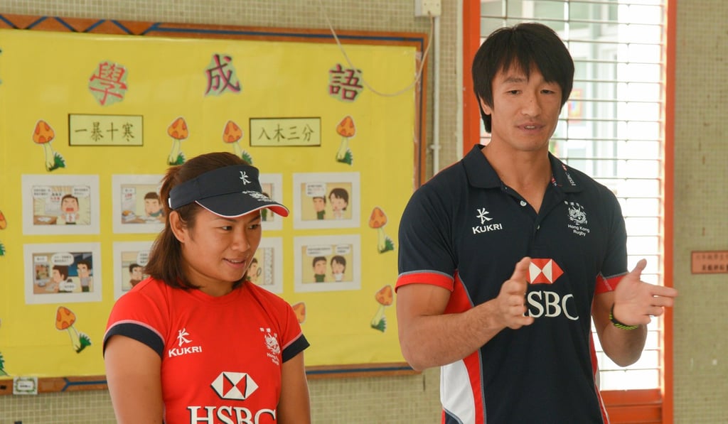 Hong Kong rugby players Salom Yiu (right) and Candy Cheng teach rugby at Queen Elizabeth School Old Student’s Association Primary School in Tin Shui Wai. Photo: Handout Hong Kong rugby players Salom Yiu (right) and Candy Cheng teach rugby at Queen Elizabeth School Old Student’s Association Primary School in Tin Shui Wai. Photo: Handout