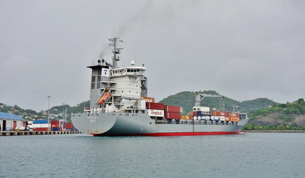 A container cargo ship approaches the port of St George's. Photo: Shutterstock
