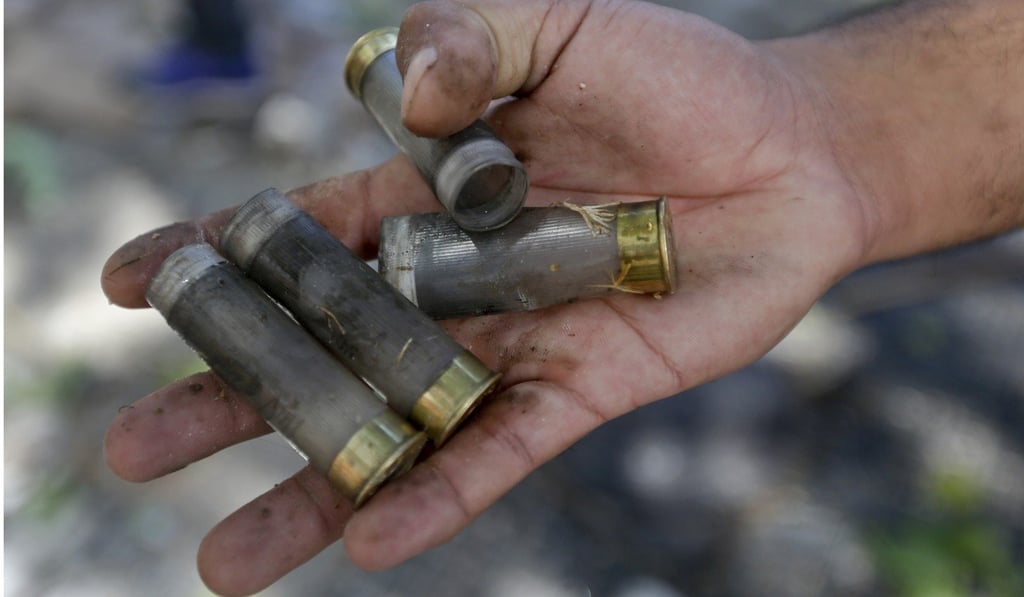 A protester shows spent casings of rubber bullets fired by police during a general strike in Buenos Aires, Argentina, on Monday. Photo: AP A protester shows spent casings of rubber bullets fired by police during a general strike in Buenos Aires, Argentina, on Monday. Photo: AP