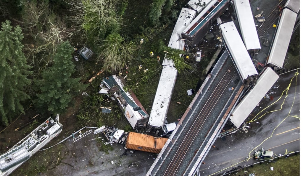 Cars from an Amtrak train that derailed above lie spilled onto Interstate 5 on Monday in DuPont, Washington. Photo: AP