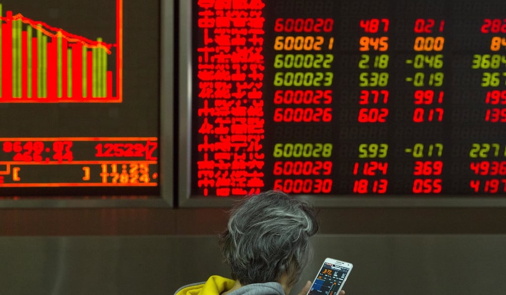 An investor surveys stock prices at a brokerage in Beijing on December 19, 2017. Photo: AP An investor surveys stock prices at a brokerage in Beijing on December 19, 2017. Photo: AP