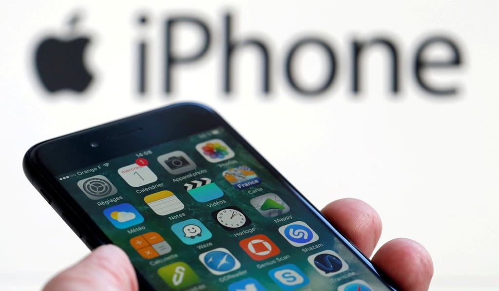 An Apple iPhone 7 and the company logo are seen in this illustration picture taken on February 1, 2017. Photo: Reuters