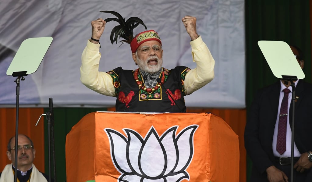 Indian Prime Minister Narendra Modi in traditional Khasi attire and Garo headgear at a campaign rally. Photo: EPA