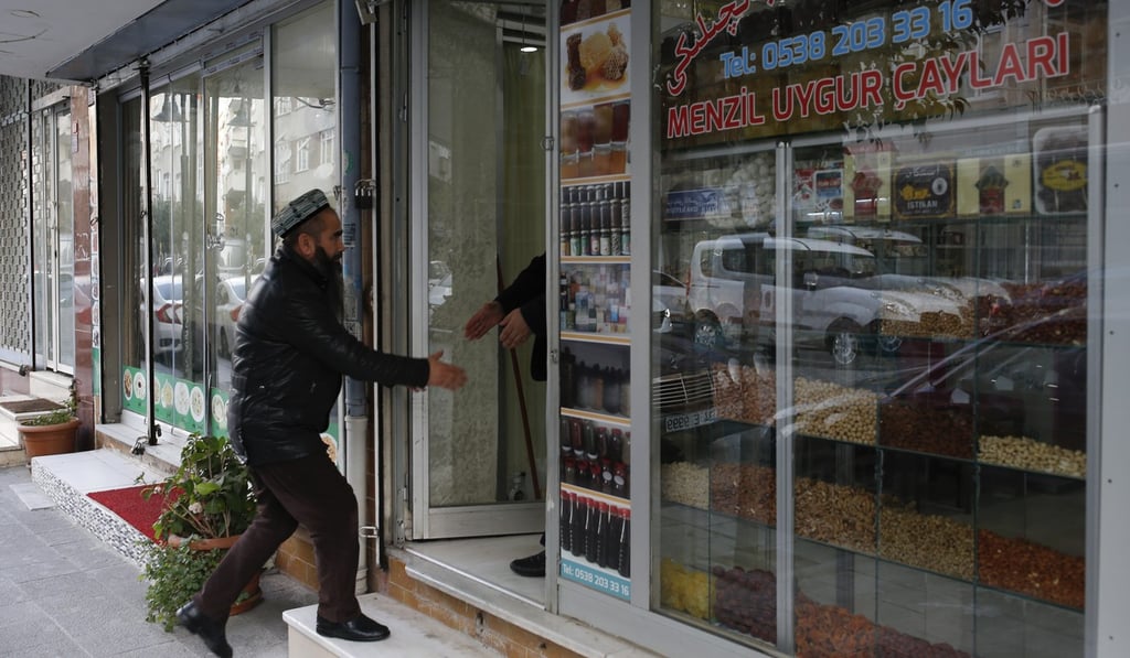 A man enters a shop in the Uygur immigrant neighbourhood of Zeytinburnu, Istanbul. Since 2013, thousands of Uygurs have travelled to Syria from western China to train and fight alongside al-Qaeda. Photo: AP