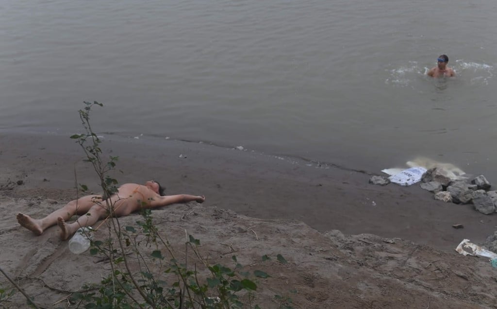 Nudists brave the weather for their daily exercise. Photo: AFP Nudists brave the weather for their daily exercise. Photo: AFP